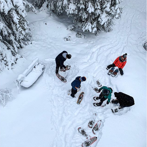 Aerial shot of the northern girls preparing for a snow hike